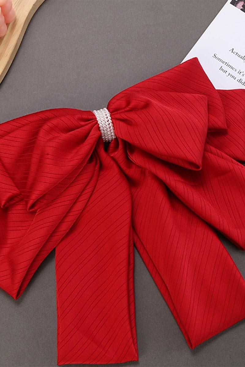 FLIRTY FLUTTER BOW