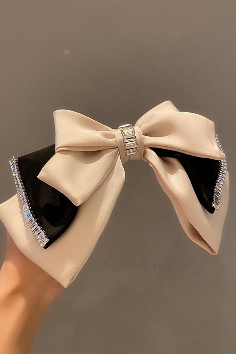 TEASE AND TWIRL BOW