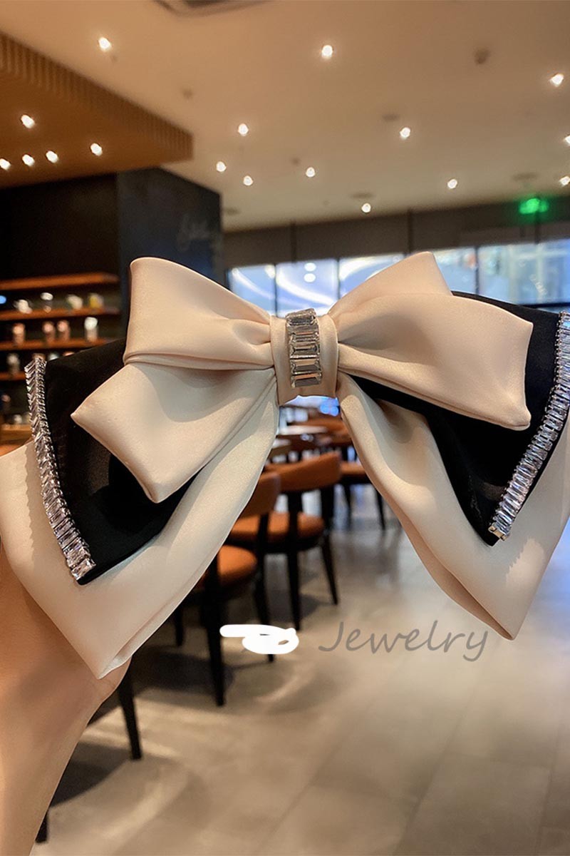 TEASE AND TWIRL BOW