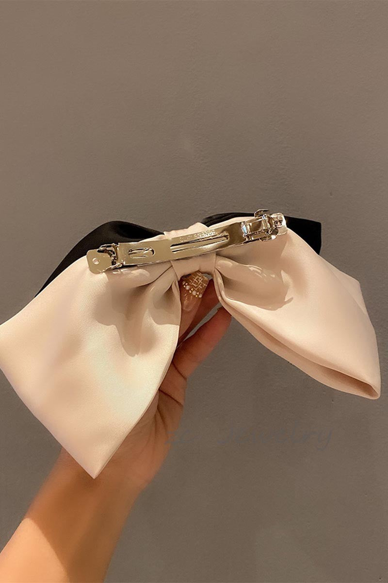 TEASE AND TWIRL BOW