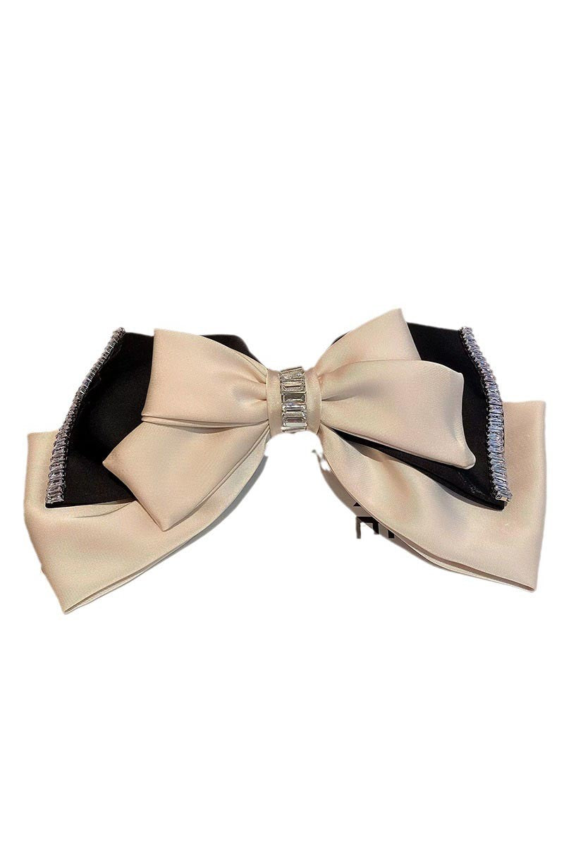 TEASE AND TWIRL BOW