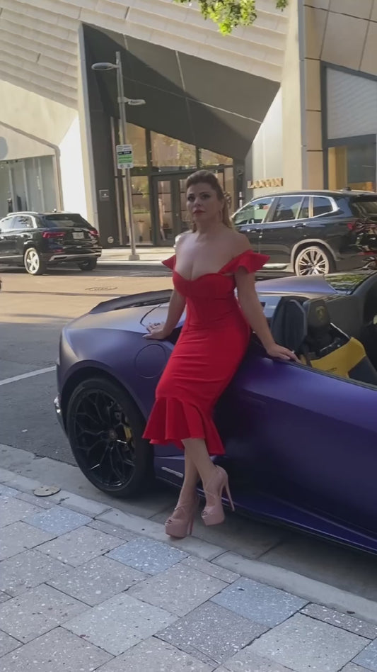 wowan in red bandage dress on top of a lamborghini. Red party dress. Red club dress. 